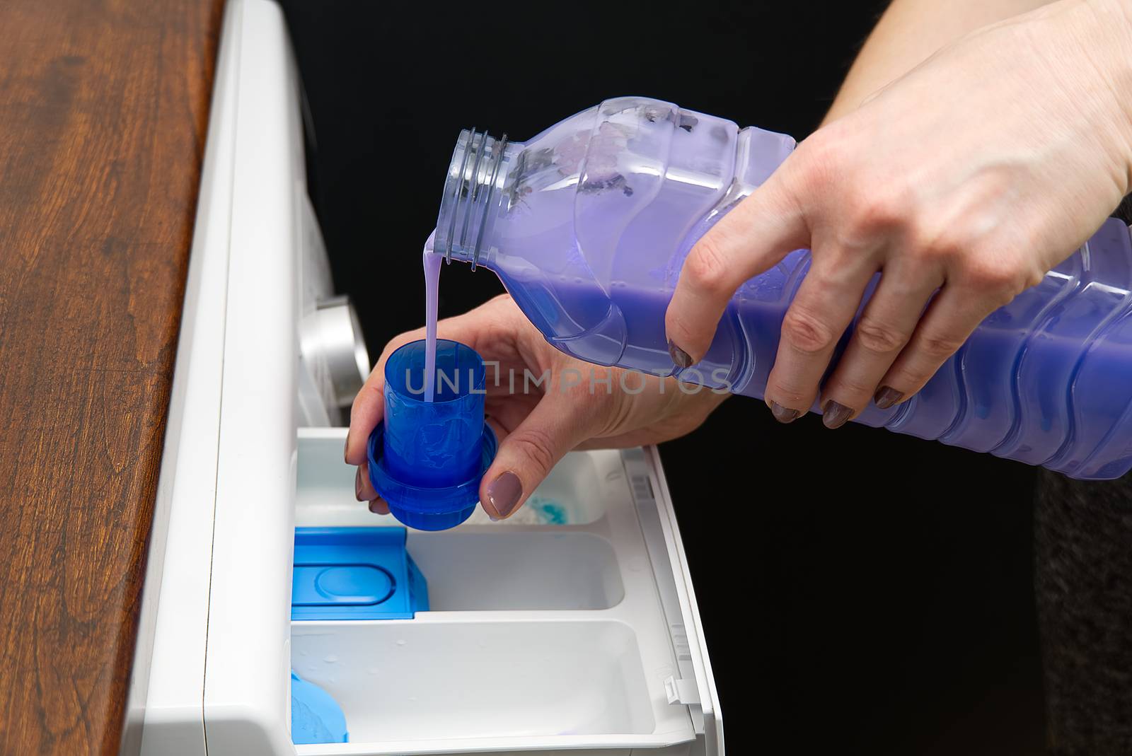 Container for washing powder and liquid. Washing machine for clothes and laundry detergent with rinsing liquid.
