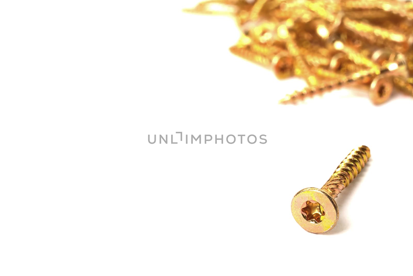 Torx screws close up. Gold screws for wood, chipboard or plywood with torx head. by PhotoTime