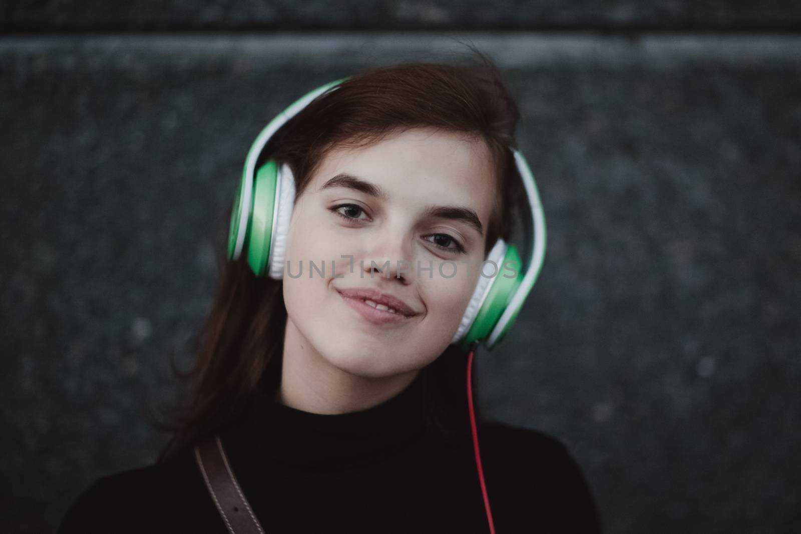 Web radios music concept. Young pretty girl listening music with headphones. by primipil