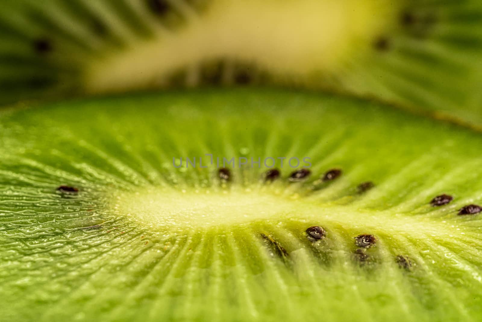 Macro shot of a kiwi slice. Healthy food.