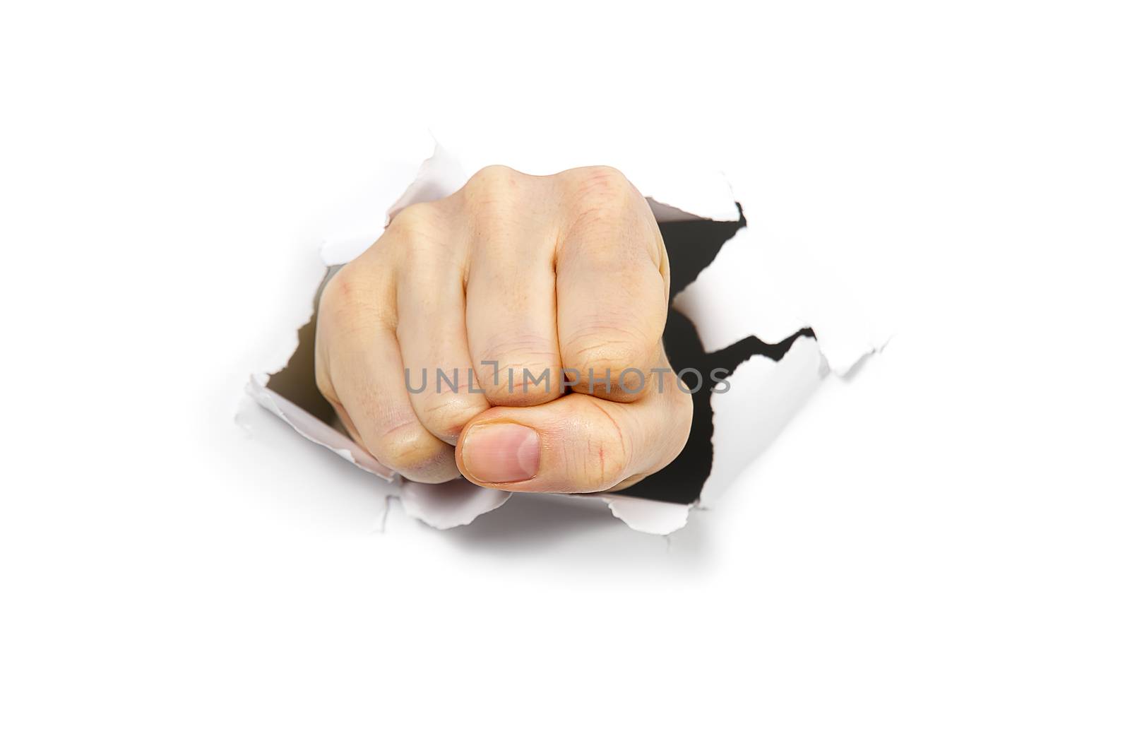 punching hole through paper wall with fist. Punch break through the paper wall. Fist coming out the paper hole isolated on white background.