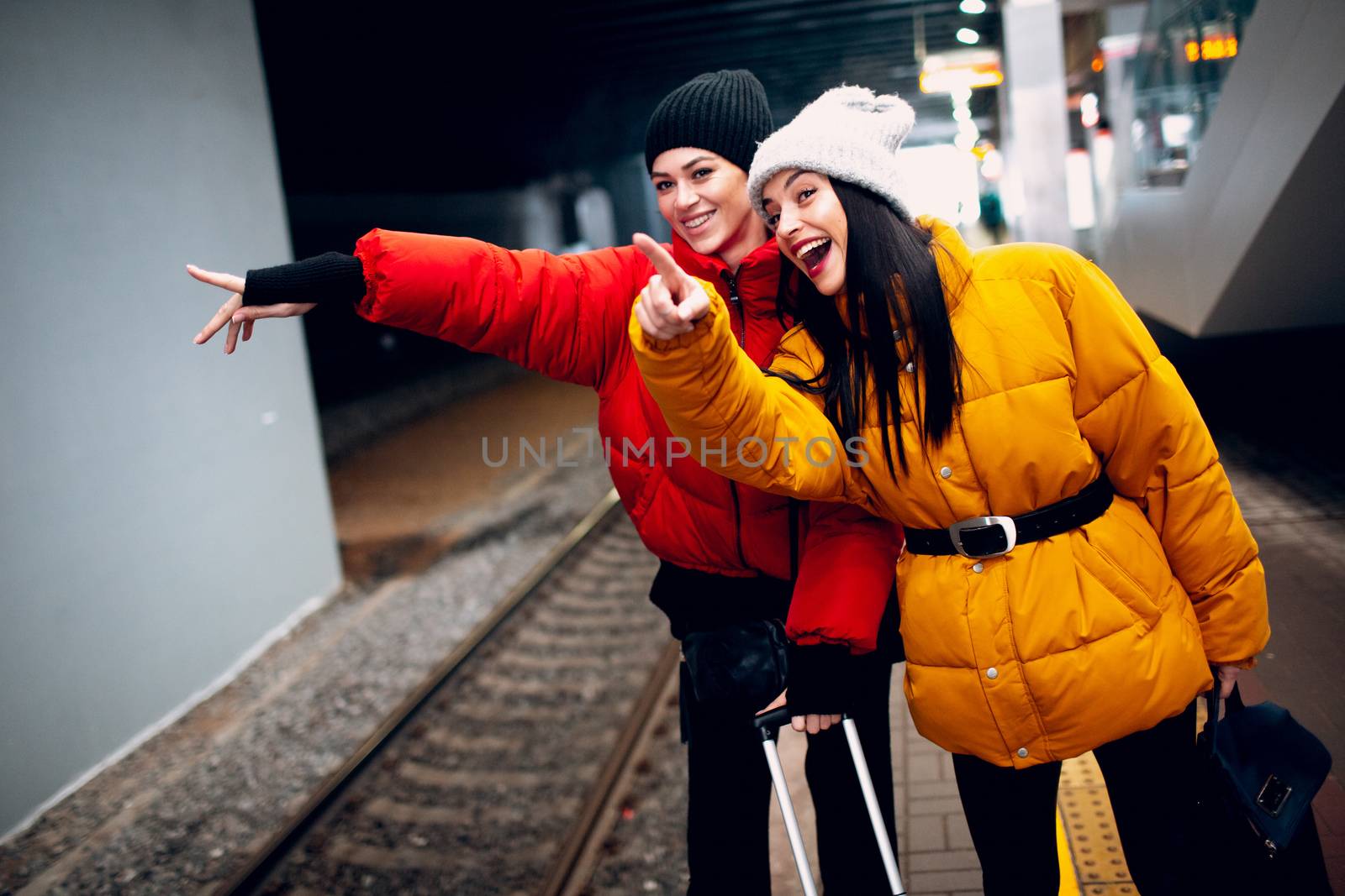 Two young women and train by primipil