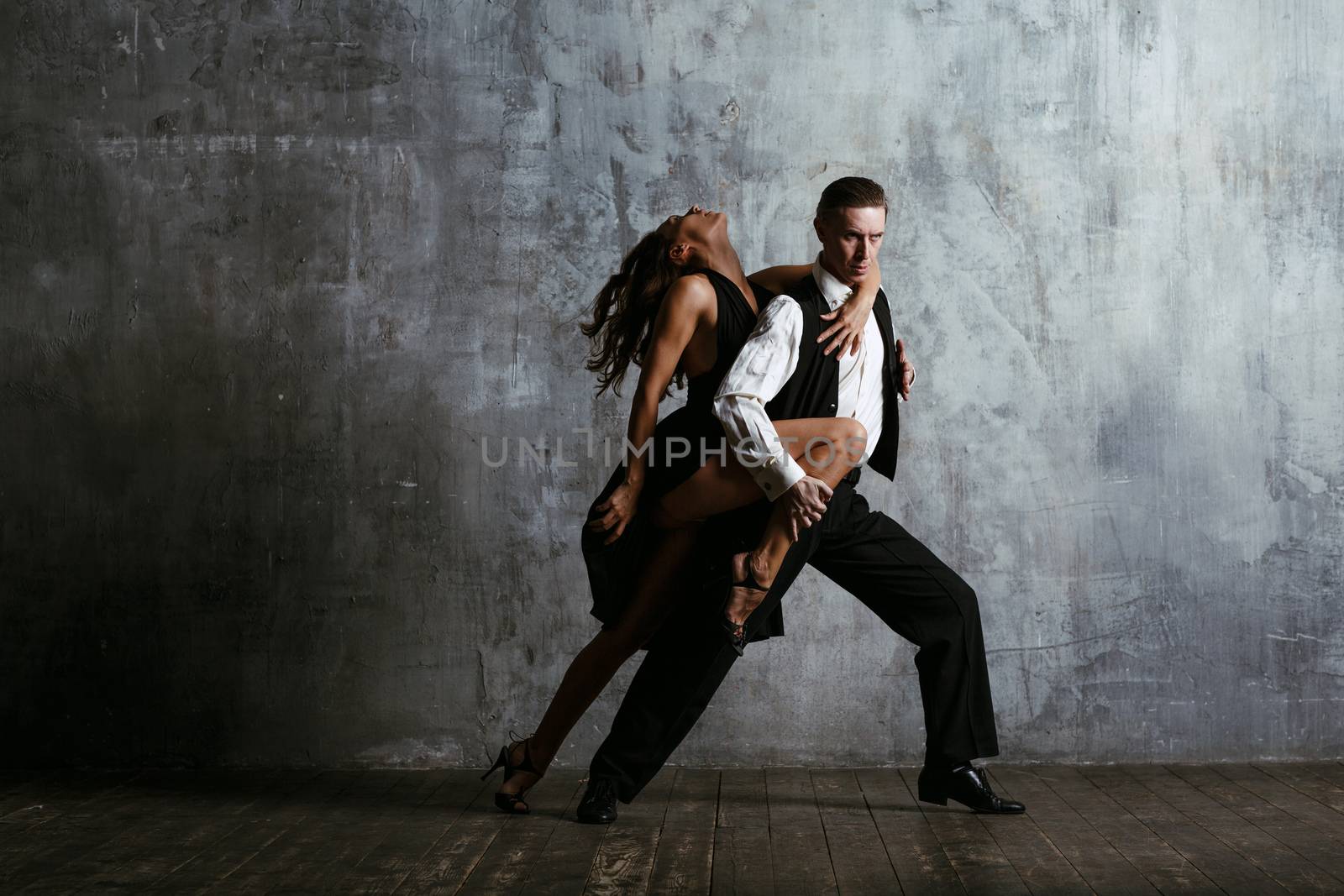 Woman and man dancing tango by primipil