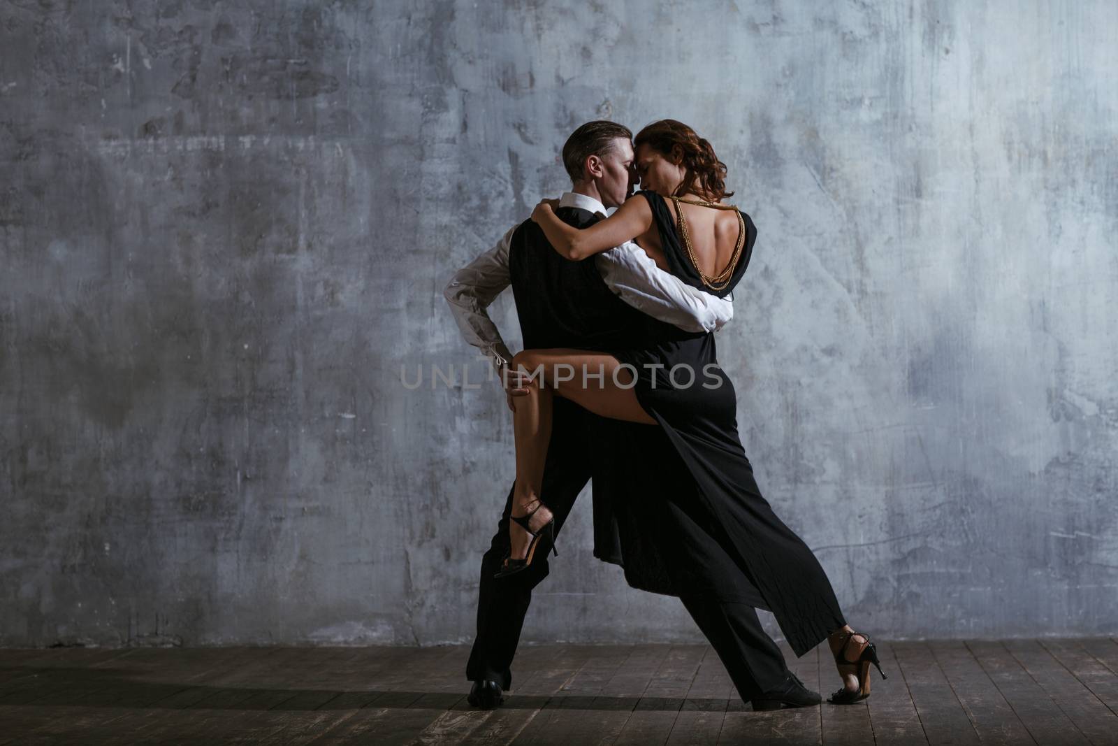 Woman and man dancing tango by primipil