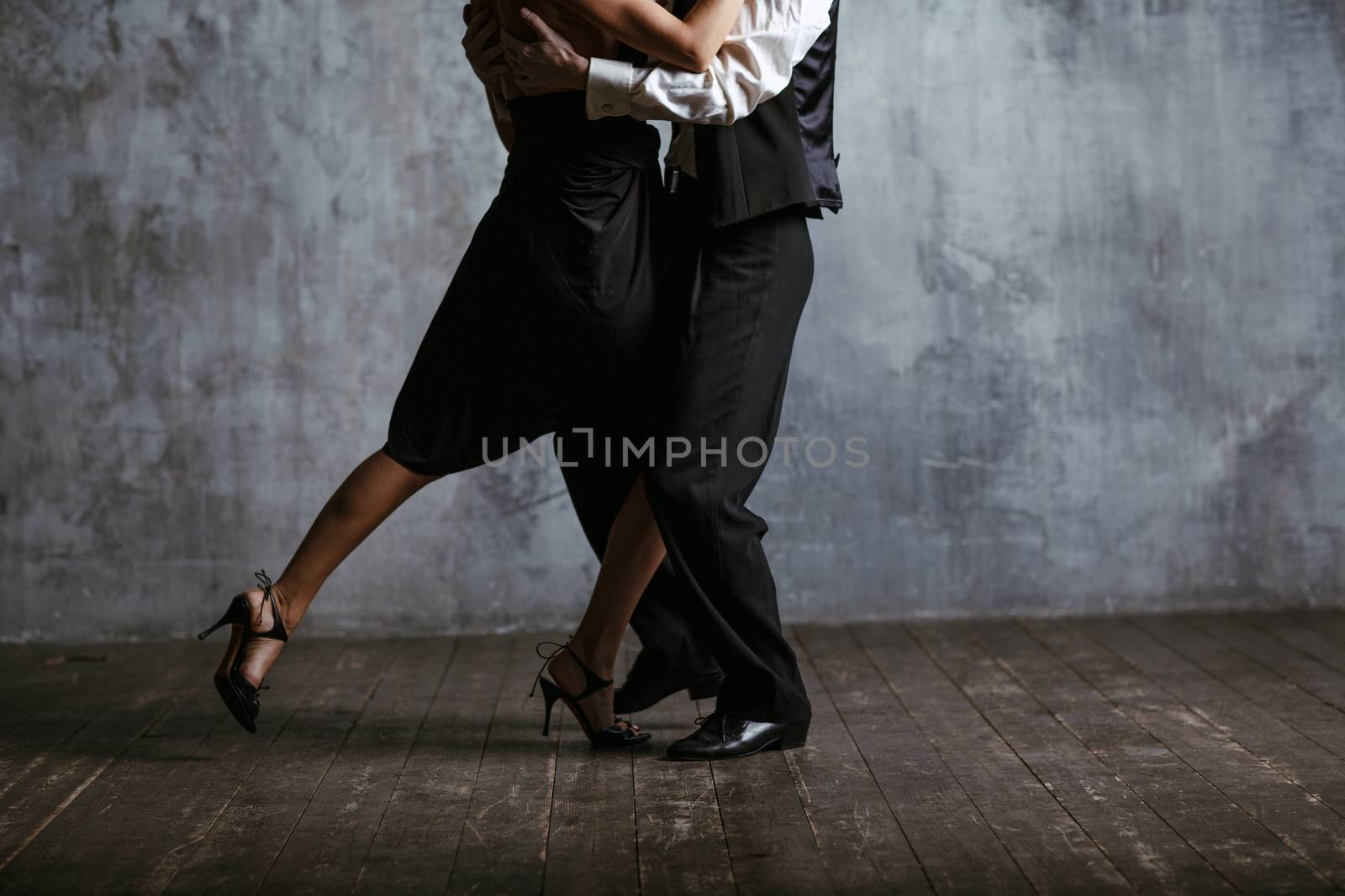 Young pretty woman in black dress and man dance valse by primipil