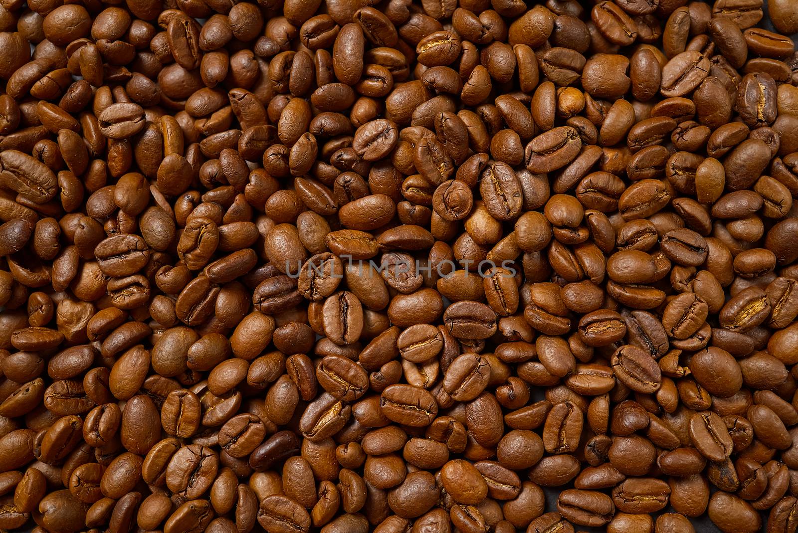 Texture of coffee beans. Roasted coffee beans background. close up Coffee beans by PhotoTime