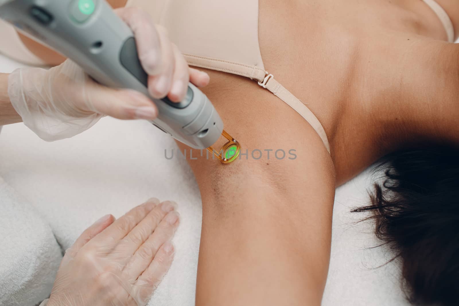 Laser epilation of armpits and cosmetology. Hair removal cosmetology procedure. Laser epilation and cosmetology. Cosmetology and SPA concept. by primipil