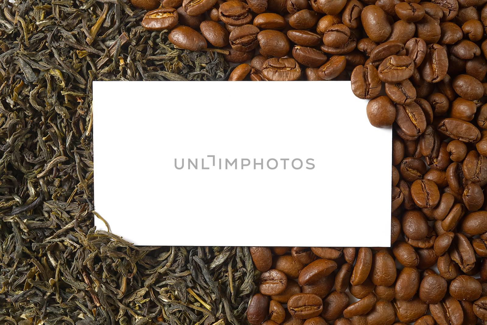 Dry leaves of green tea and fine Roasted coffee beans, top view closeup. Coffee or Green tea concept. white white Mockup business card on coffee and tea background.