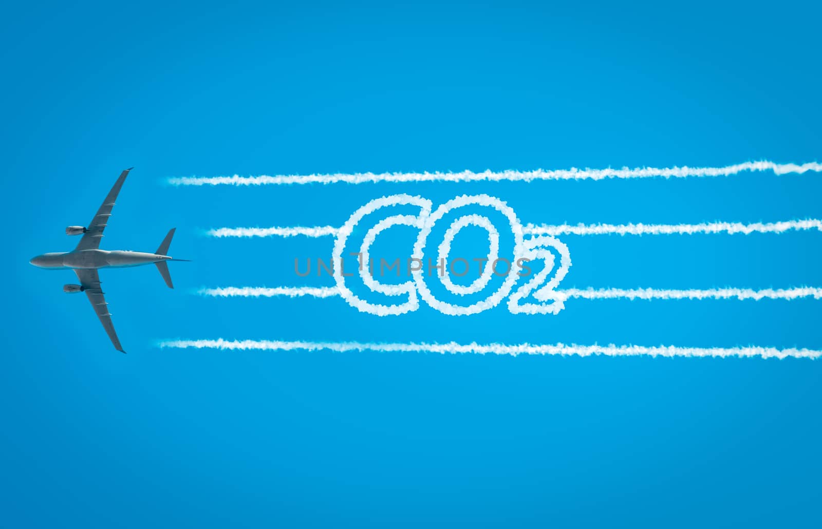 Airplane leaving jet contrails with CO2 word inside. Suitable for ecofriendly and sustainable journey concepts and the negative impact on the environment.