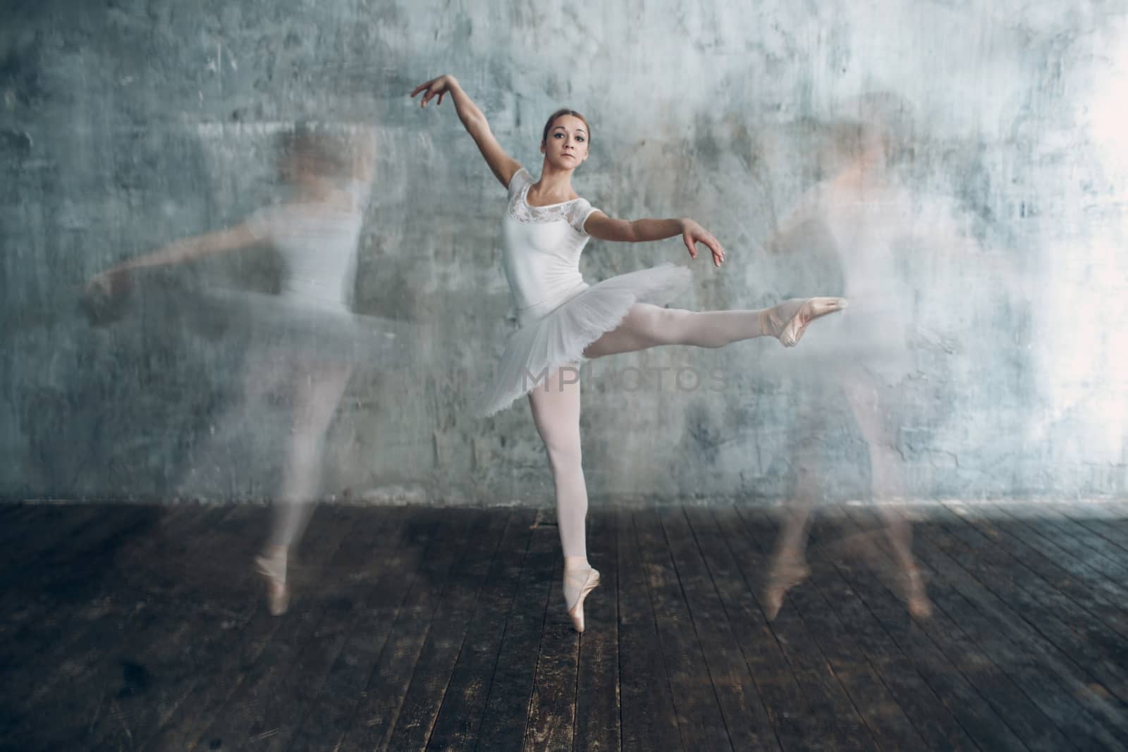 Ballerina female. Young beautiful woman ballet dancer, dressed in professional outfit, pointe shoes and white tutu. Multiple exposure.