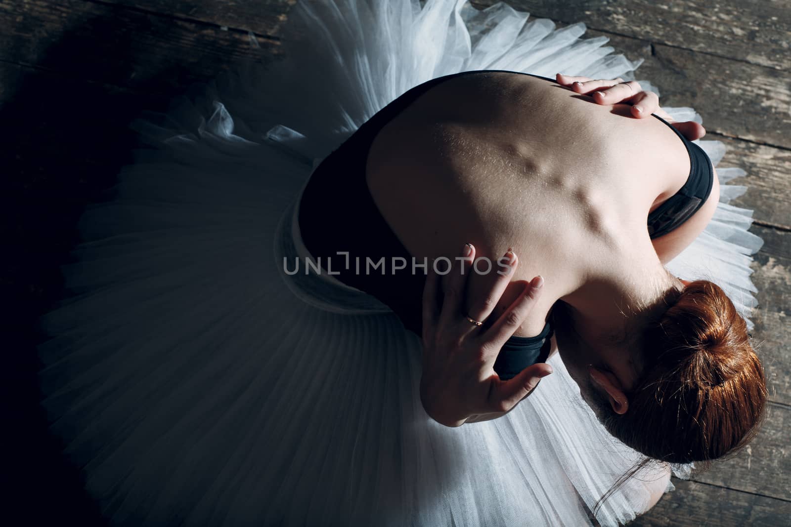 Ballerina performance on stage. Young beautiful woman ballet dancer dressed white tutu.