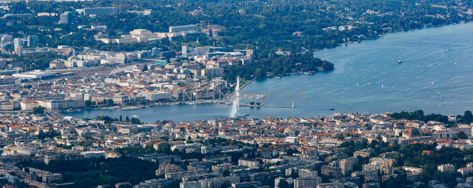 Aerial panoramic view of Geneva city center, water fountain and lake.