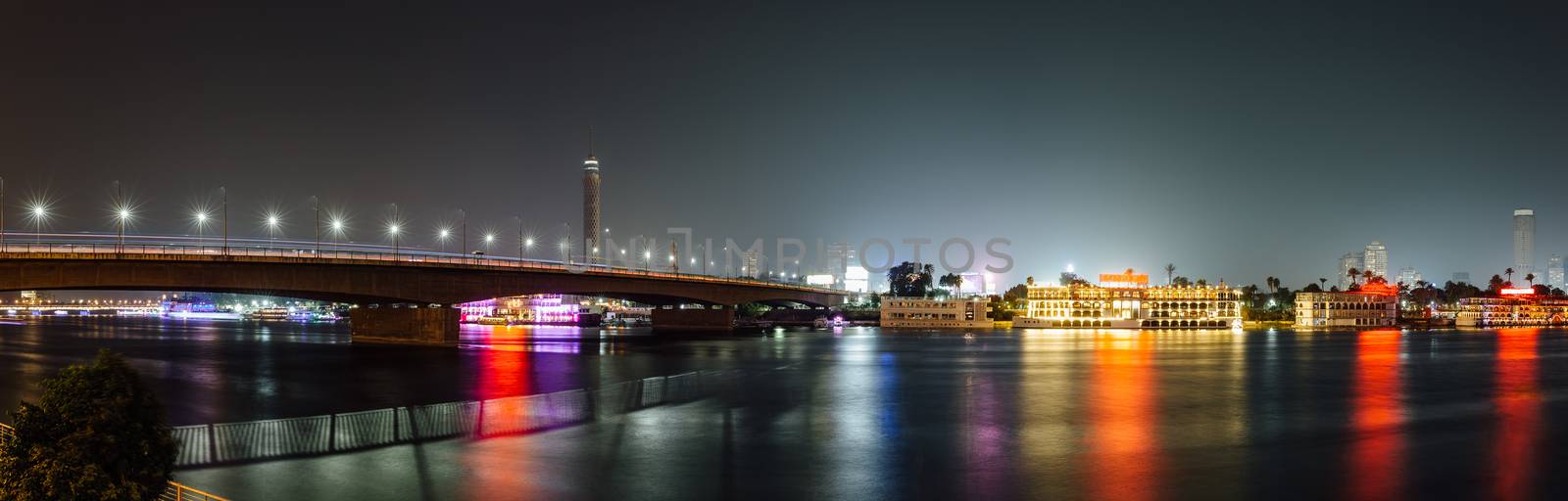 Panoramic of Cairo city center at night, long exposure with smoothed out water.