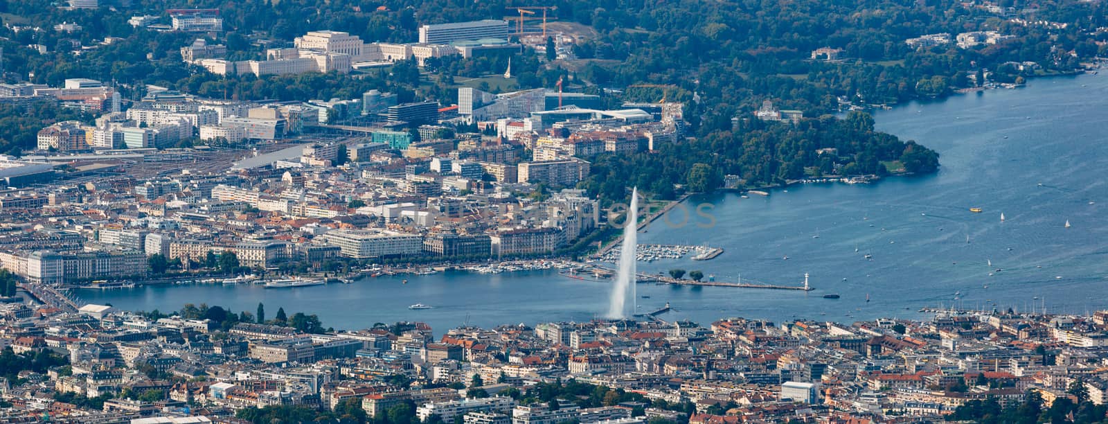 Aerial panoramic view of Geneva city center, water fountain and lake.