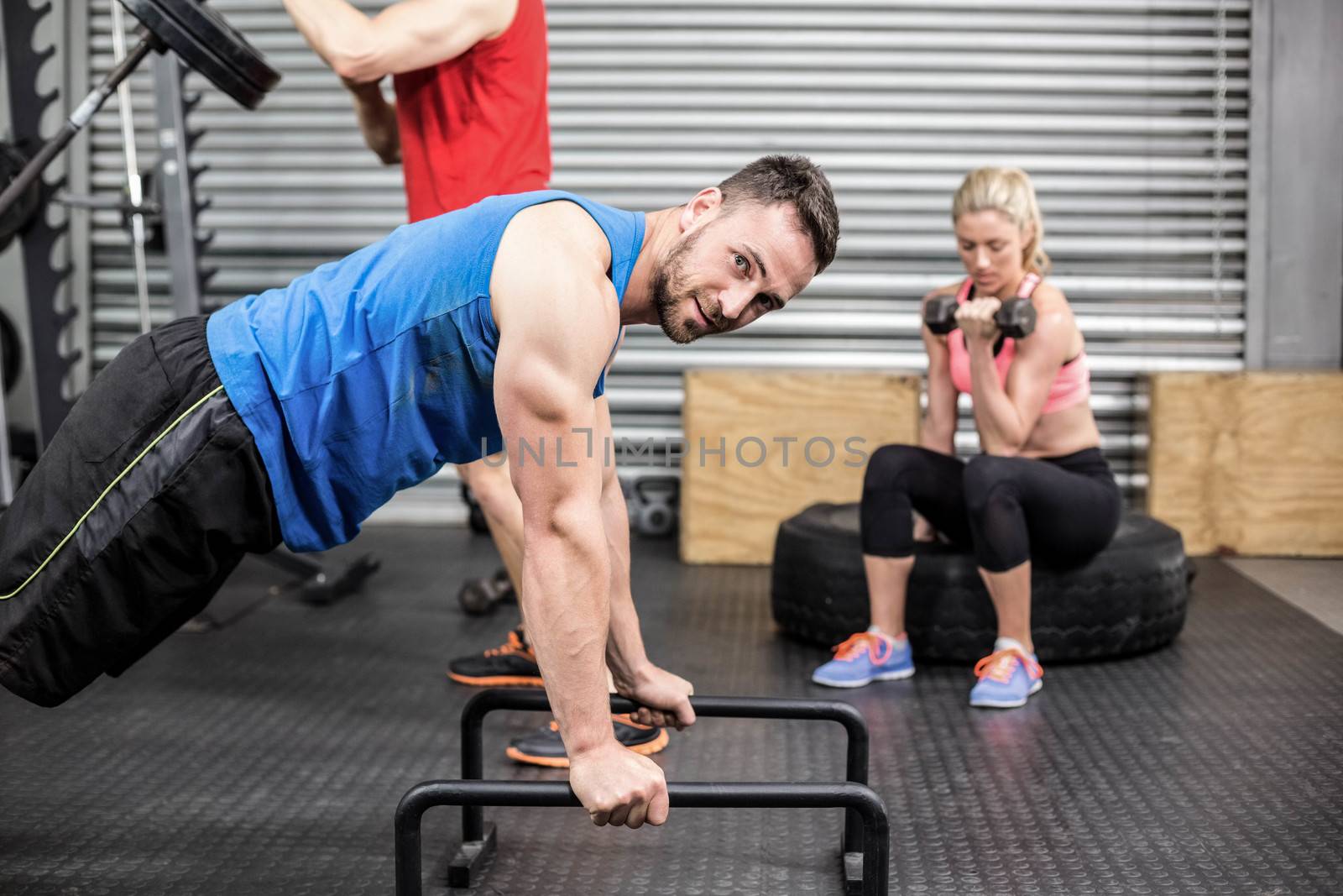 Fit people doing exercises by Wavebreakmedia