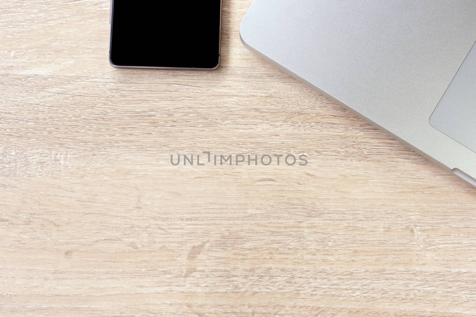 laptop and smartphone on the wood table