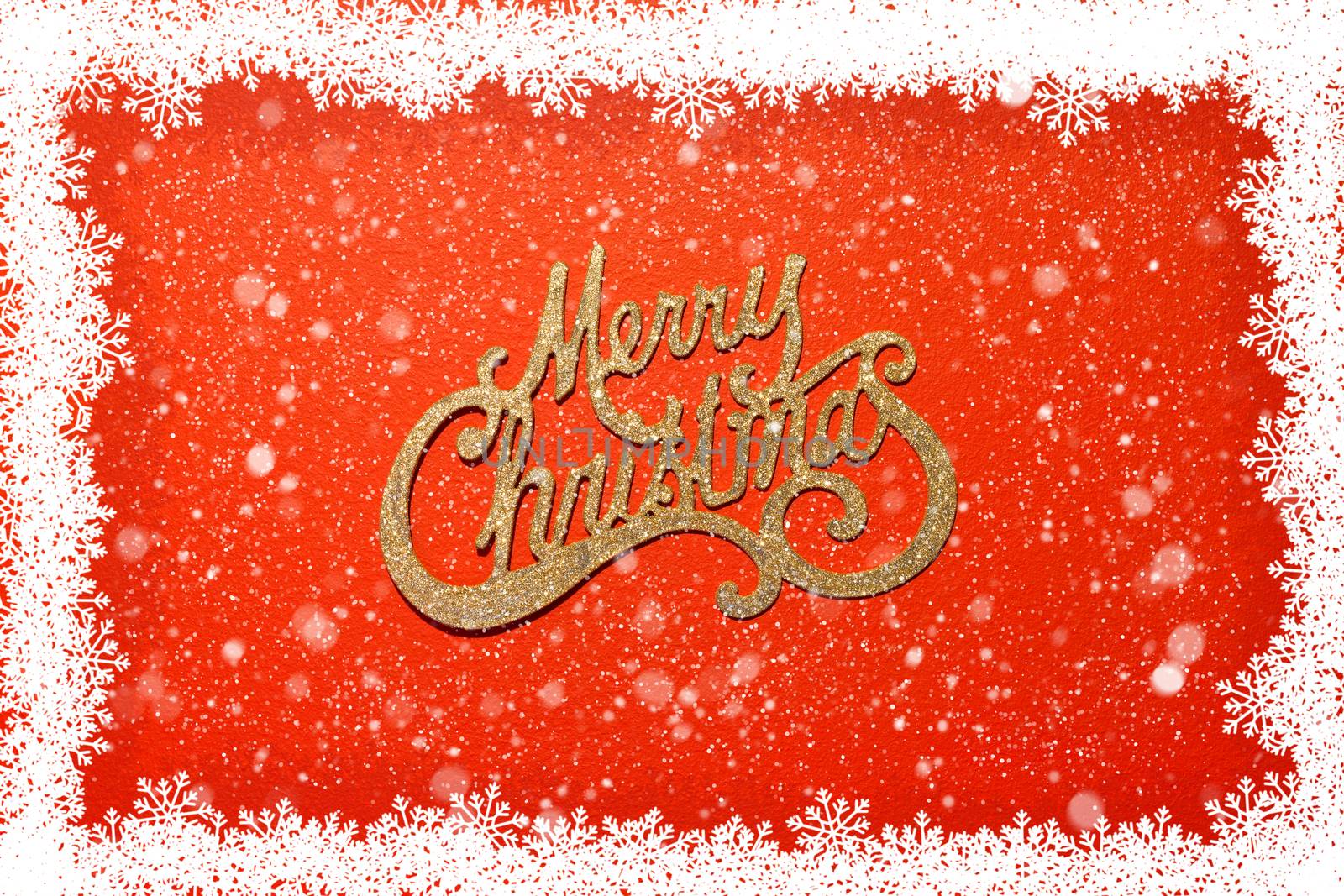 Merry Christmas on red background with snowflakes frame and snow over it