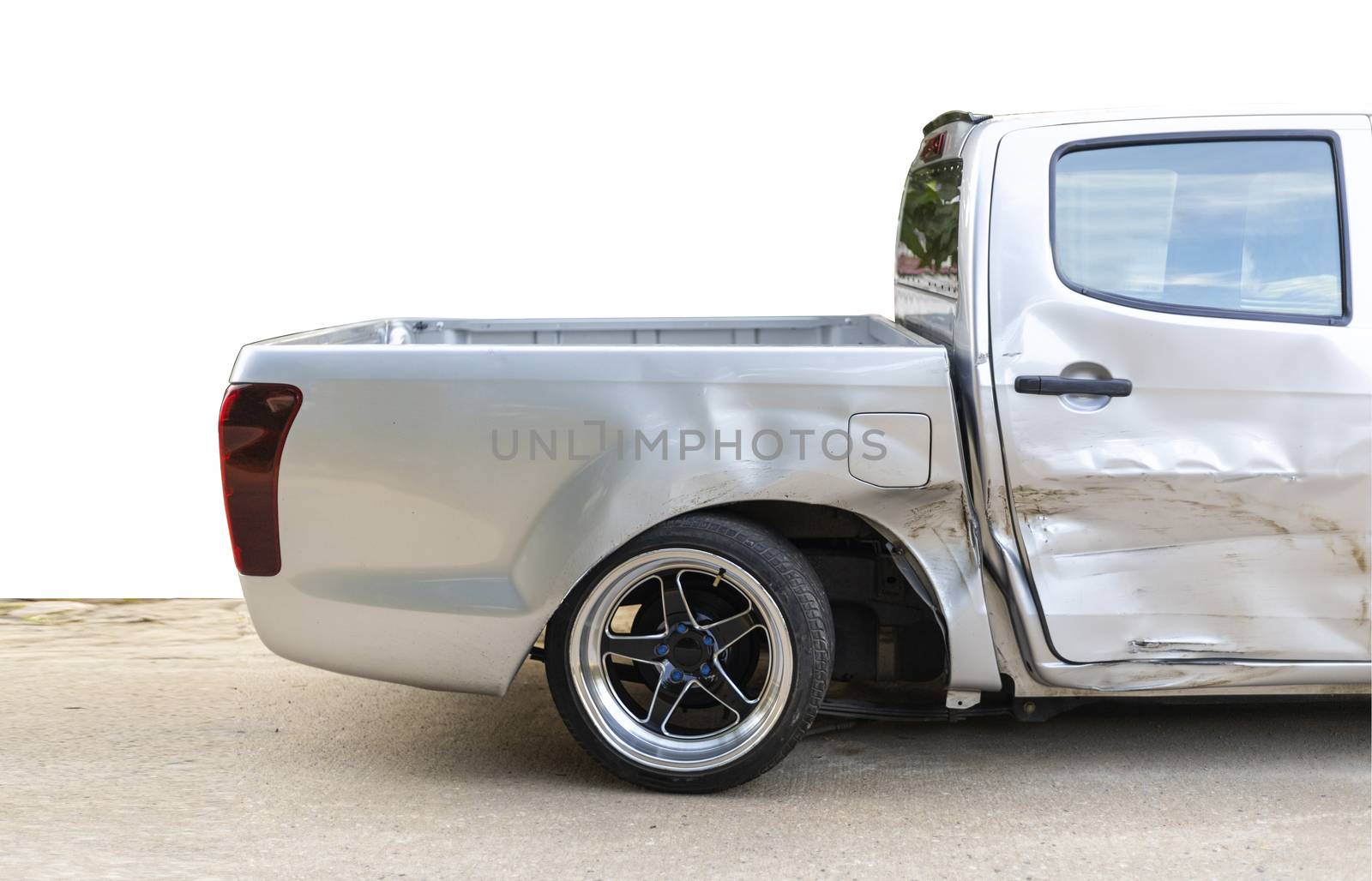 side of light gray color car with pick up damaged and broken by accident on road back wheel  abnormal can not drive any more. Isolate with cliping path