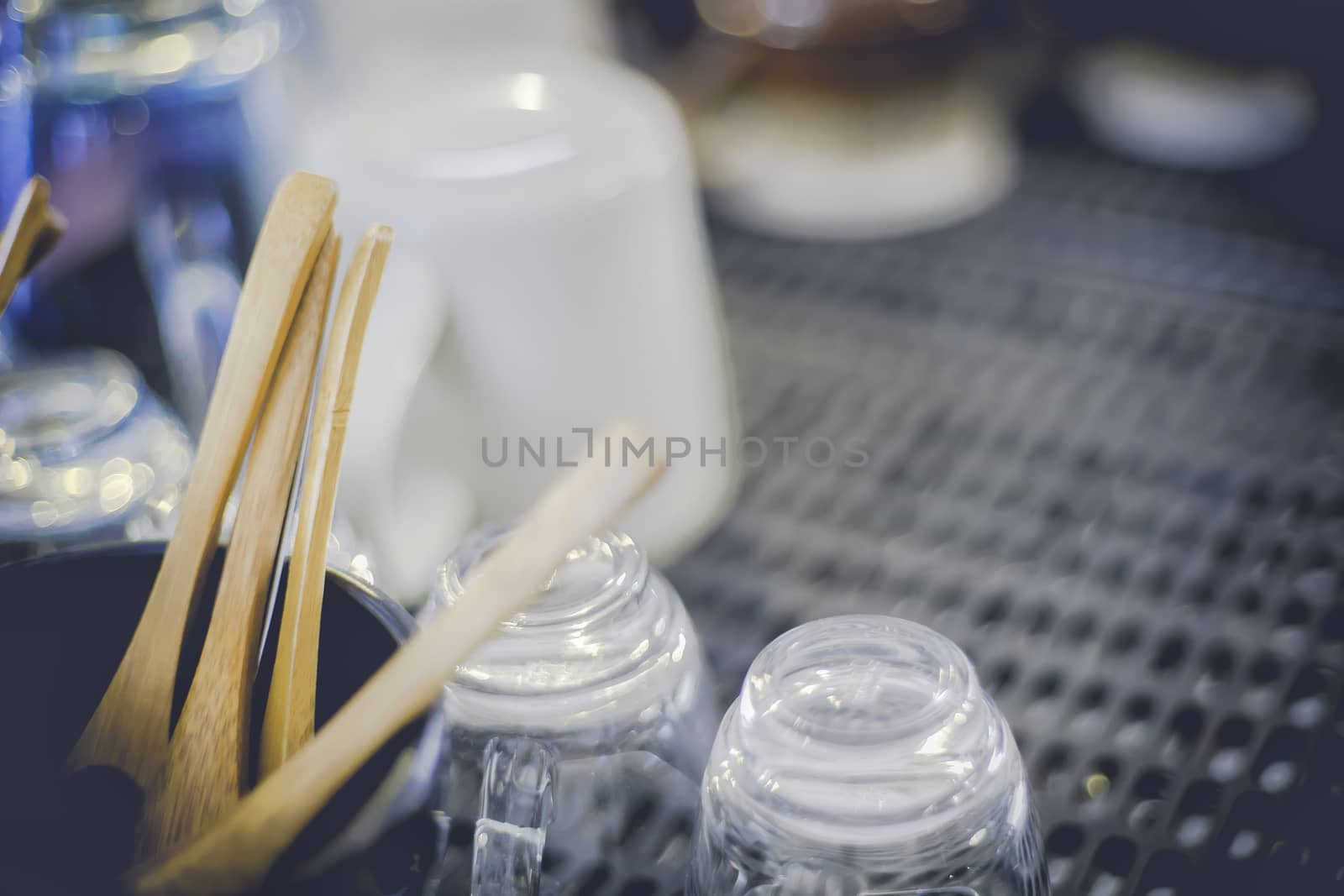 Top view of coffee machine have wood tea spoon, coffee cup and coffee shot. Soft focus and focus wood spoon. Process witn vintage style.