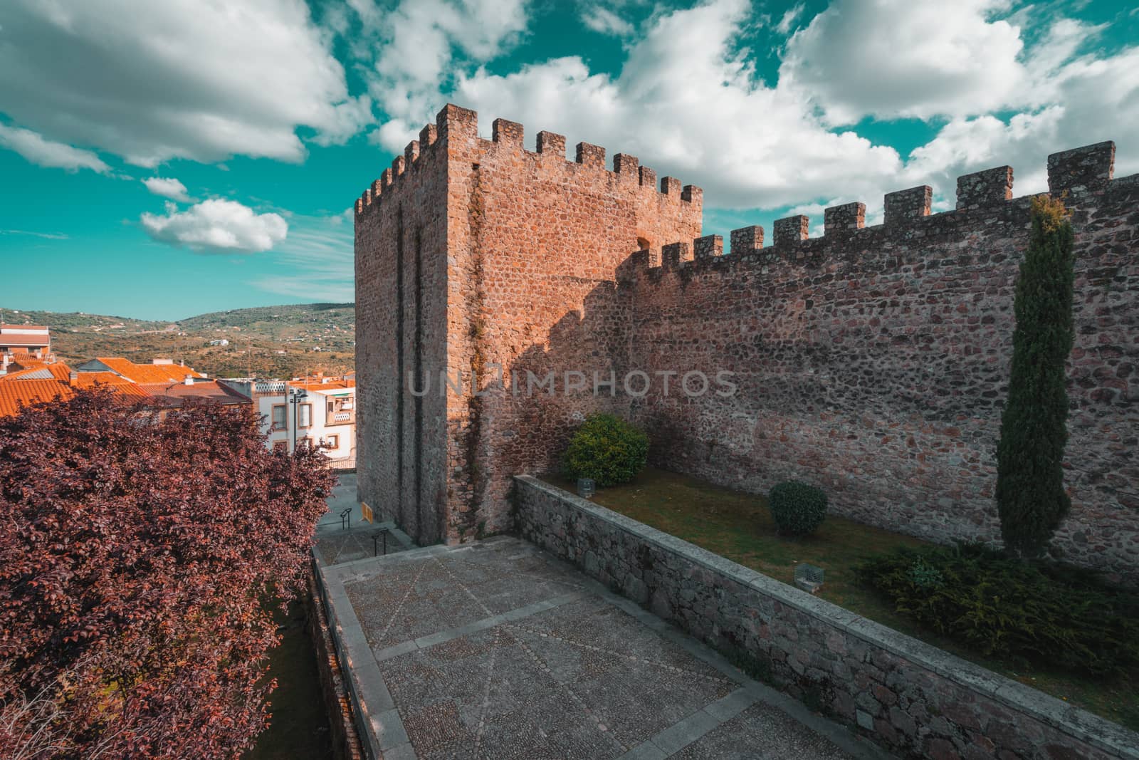 Torre Lucia defensive tower and medieval walls of Plasencia, walled market city in the province of Caceres, Spain. Teal and orange style