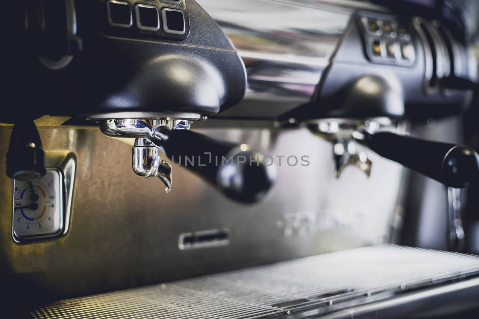 Close-Up of coffee machine in the coffee shop. len blur effect. Process with vintage style