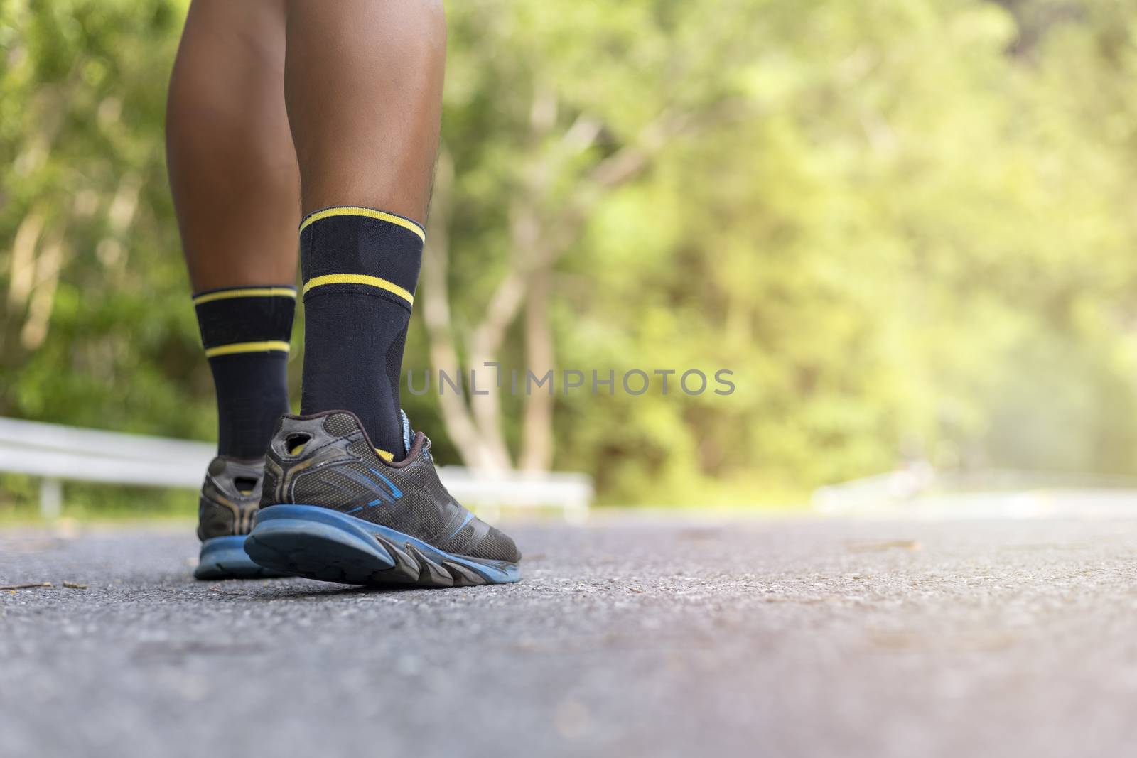 n road in Park workout wellness soft focus and focus close up on shoe  with copy space for text or design