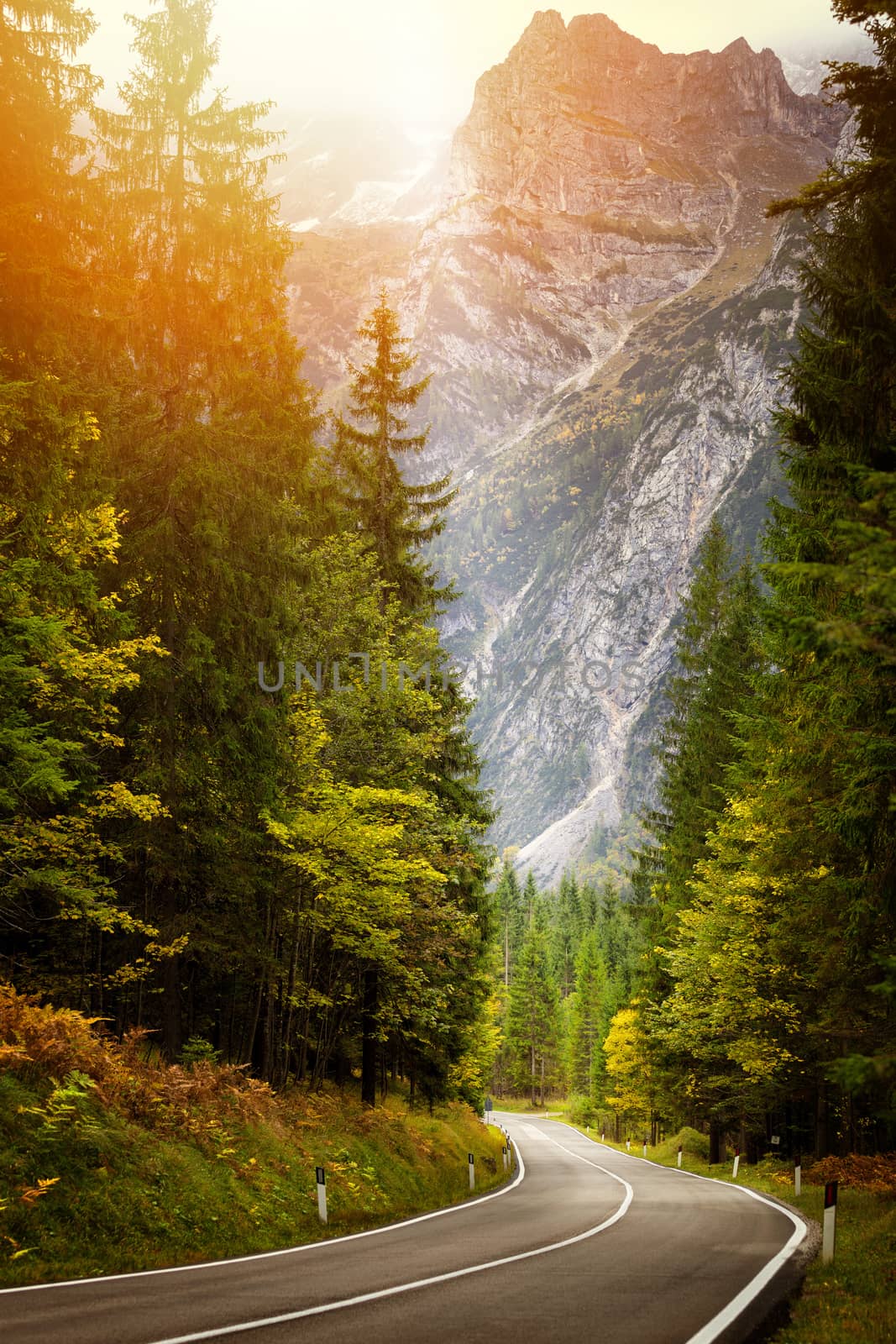 A road thru mountain pass in dolomites during autumn with beauti by necro79