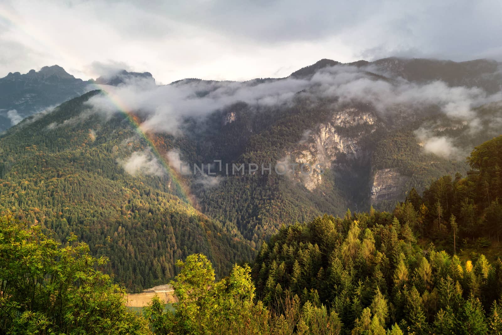 Autumn colors over the hills after the rain, Cadore, Italy, dolomites