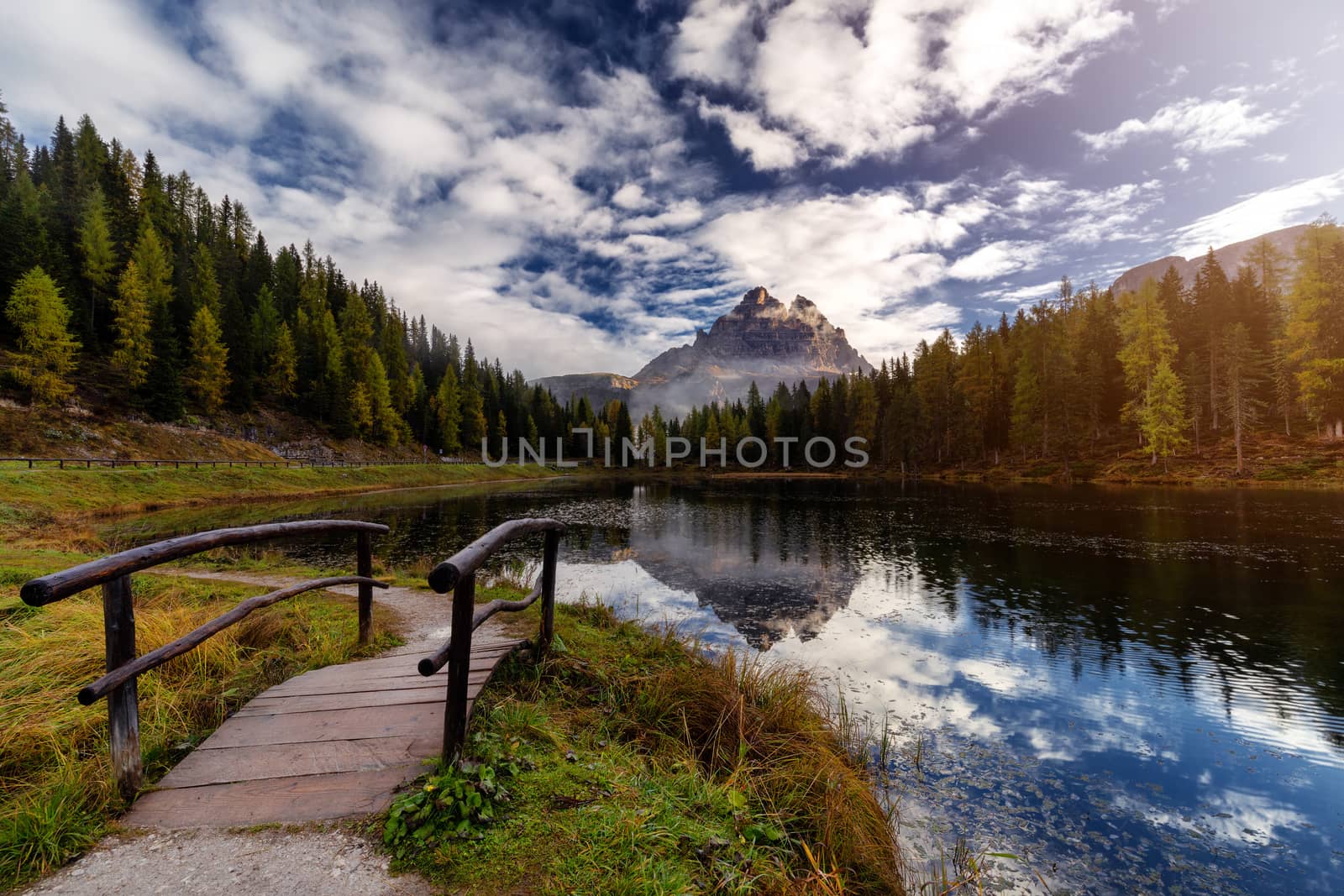 Famous Tre Cime di Lavaredo (Drei Zinnen) reflection on Antorno lake dring late autumn. Italy, Europe