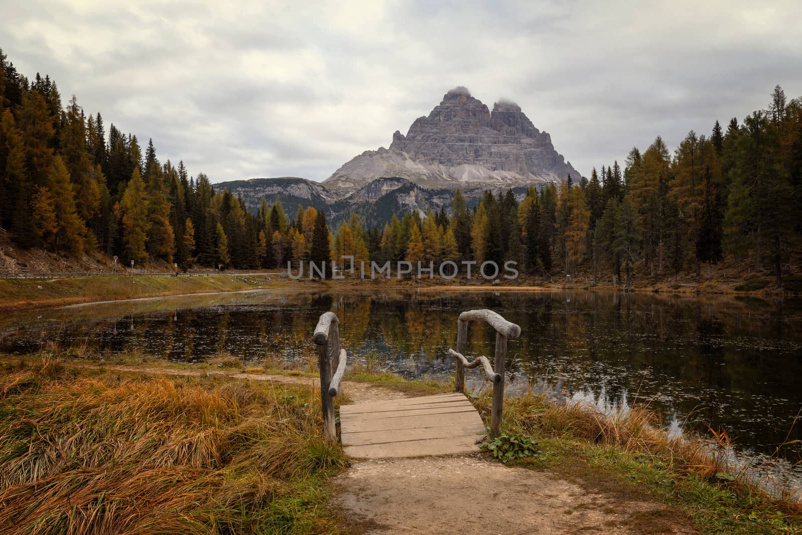 Foot path at Antorno lake, morning view of famous Tre Cime di Lavaredo (Drei Zinnen), Italy, Europe