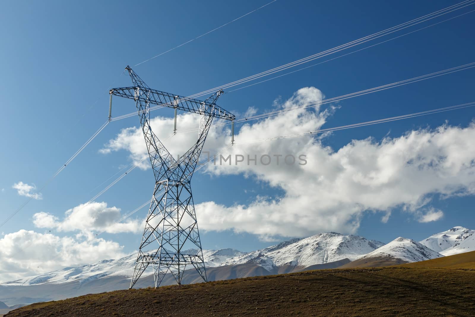 power line in the mountains of Kyrgyzstan. steel electricity pylon.