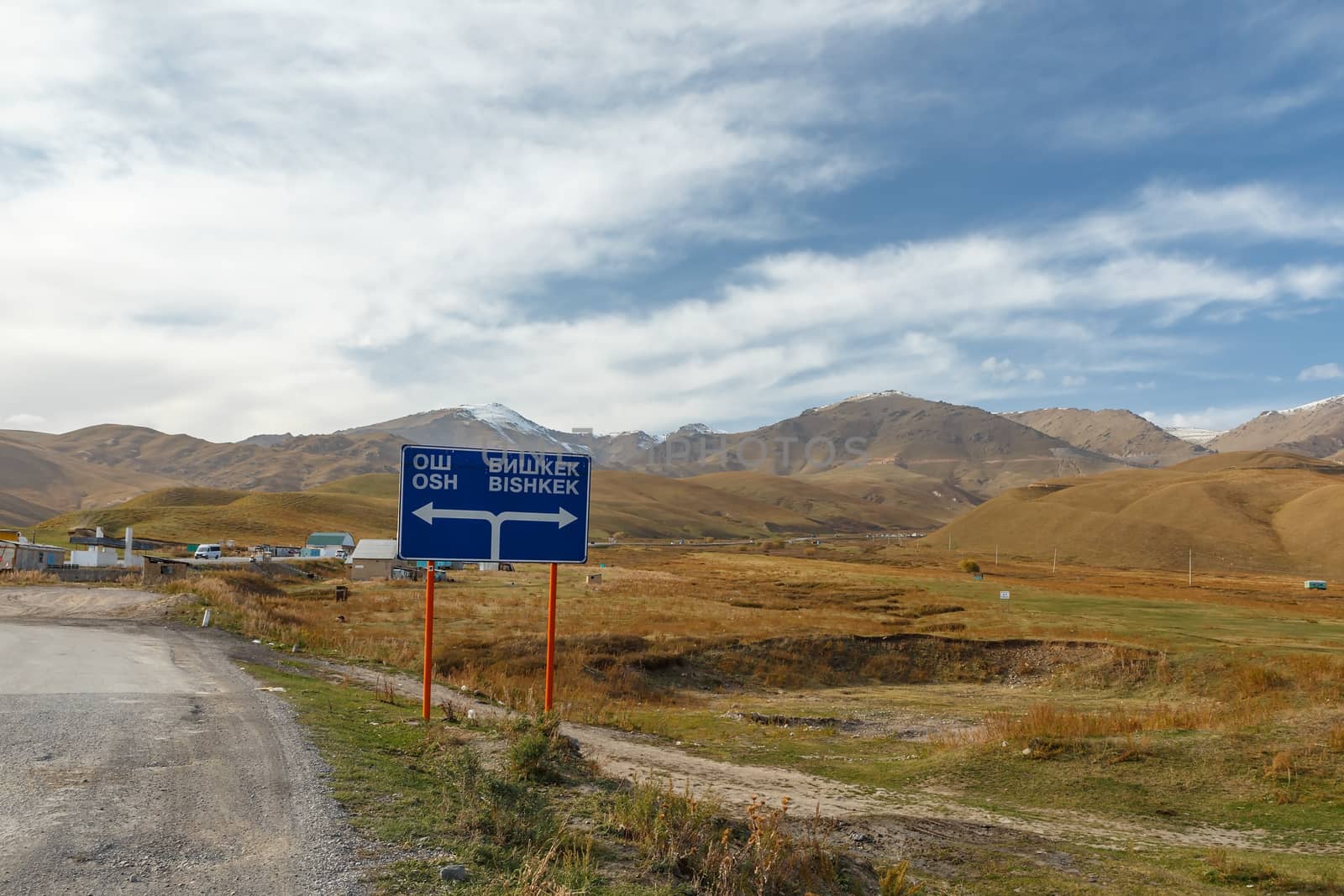A traffic sign indicating the direction to Bishkek and Osh in the Suusamyr Valley in Kyrgyzstan.