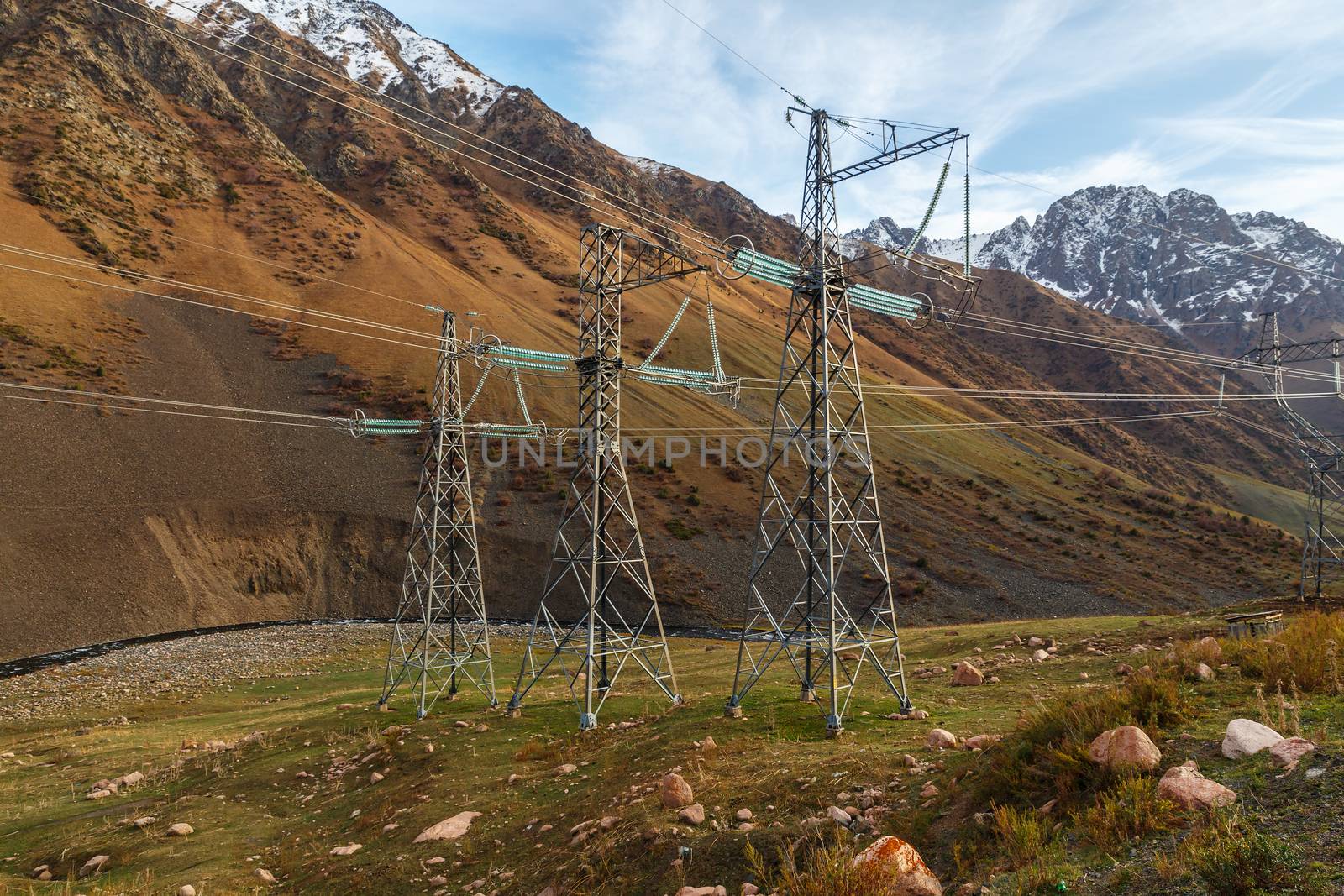 electricity pylon in a mountain gorge in Kyrgyzstan. power lines in the mountains