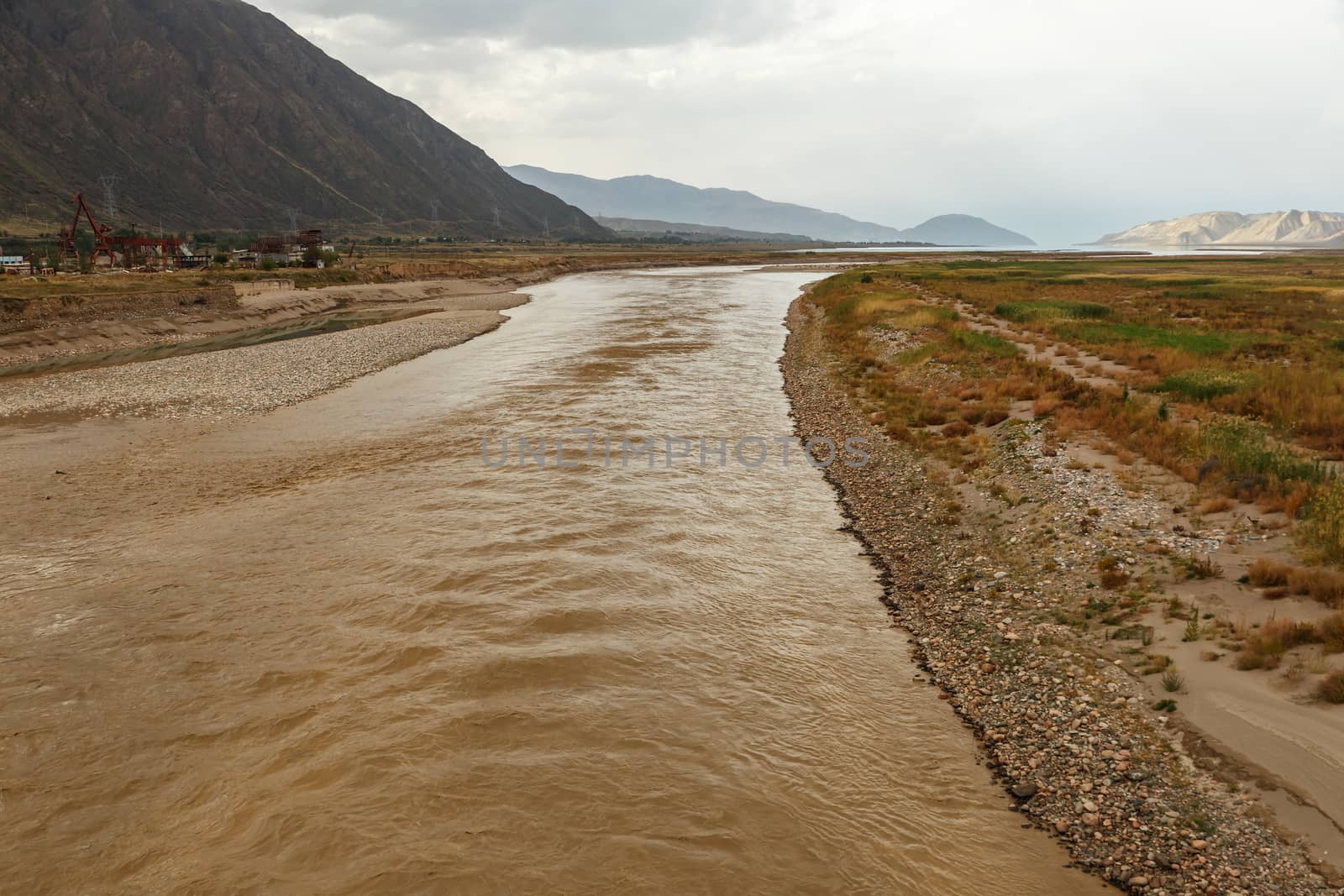 dirty water after rains in the Naryn river which flows into the Toktogul reservoir in Kyrgyzstan