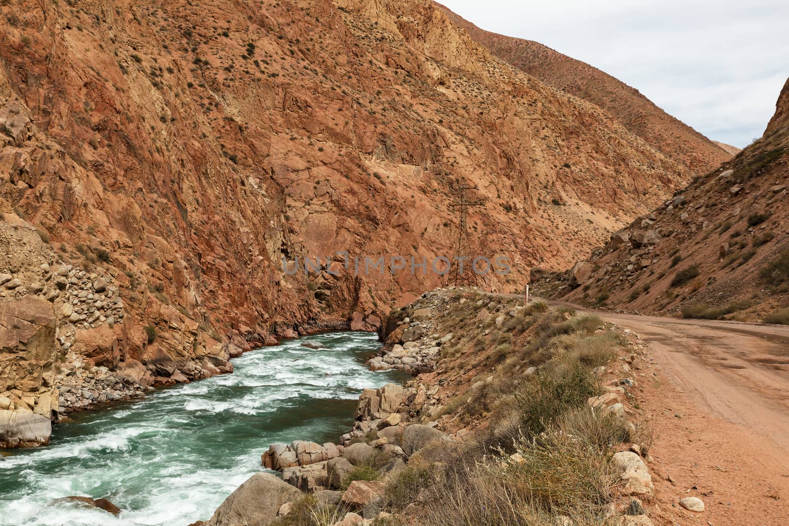 mountain road along the Kokemeren river in Naryn Region of Kyrgyzstan