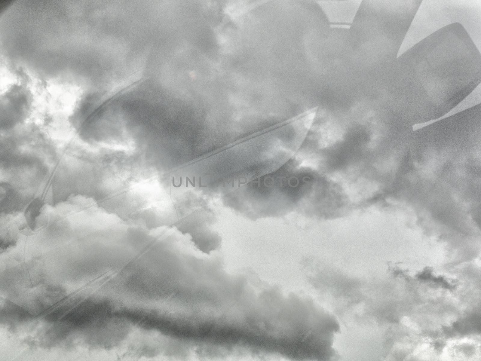 Black cloud before rainy. Black cloud background. Shot from car mirror. Process with more grain. With copy space for text or design.