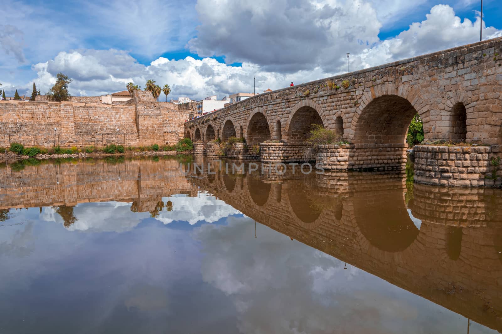 View of the Roman bridge of Merida with its reflection on the Guadiana river. Merida. Spain.The Archaeological Ensemble of Merida is declared a UNESCO World Heritage Site Ref 664