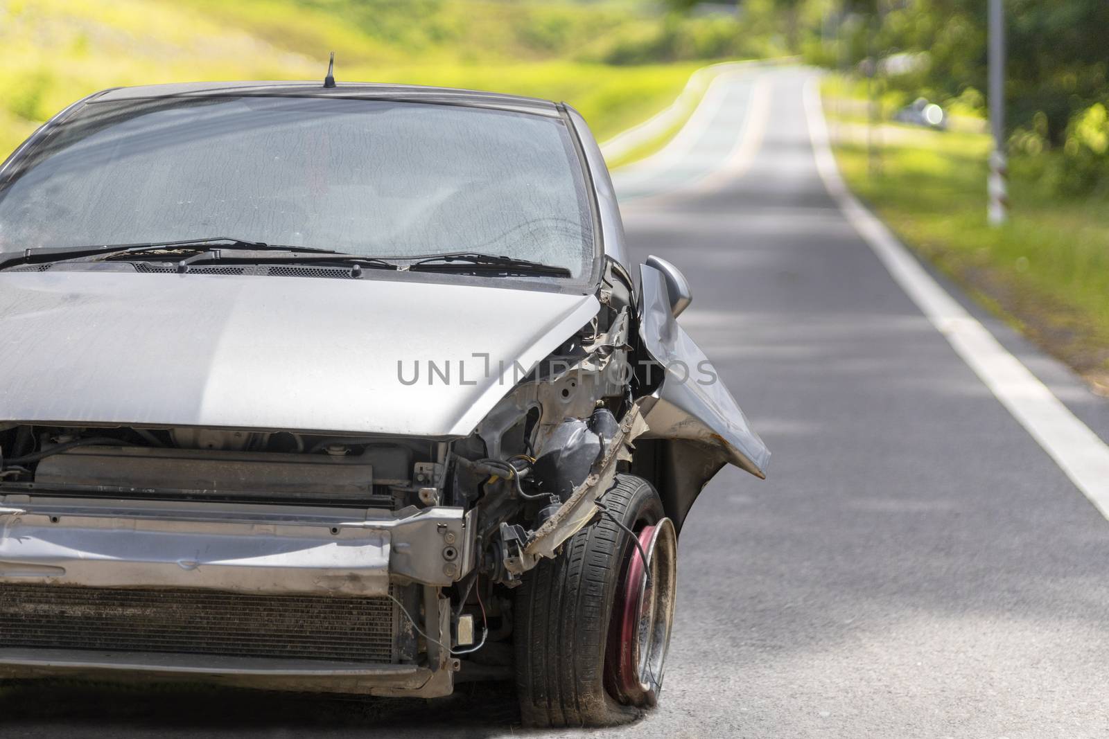 Front of gray color car big damaged and broken by accident on road parking can not drive any more. With copy space for text or design