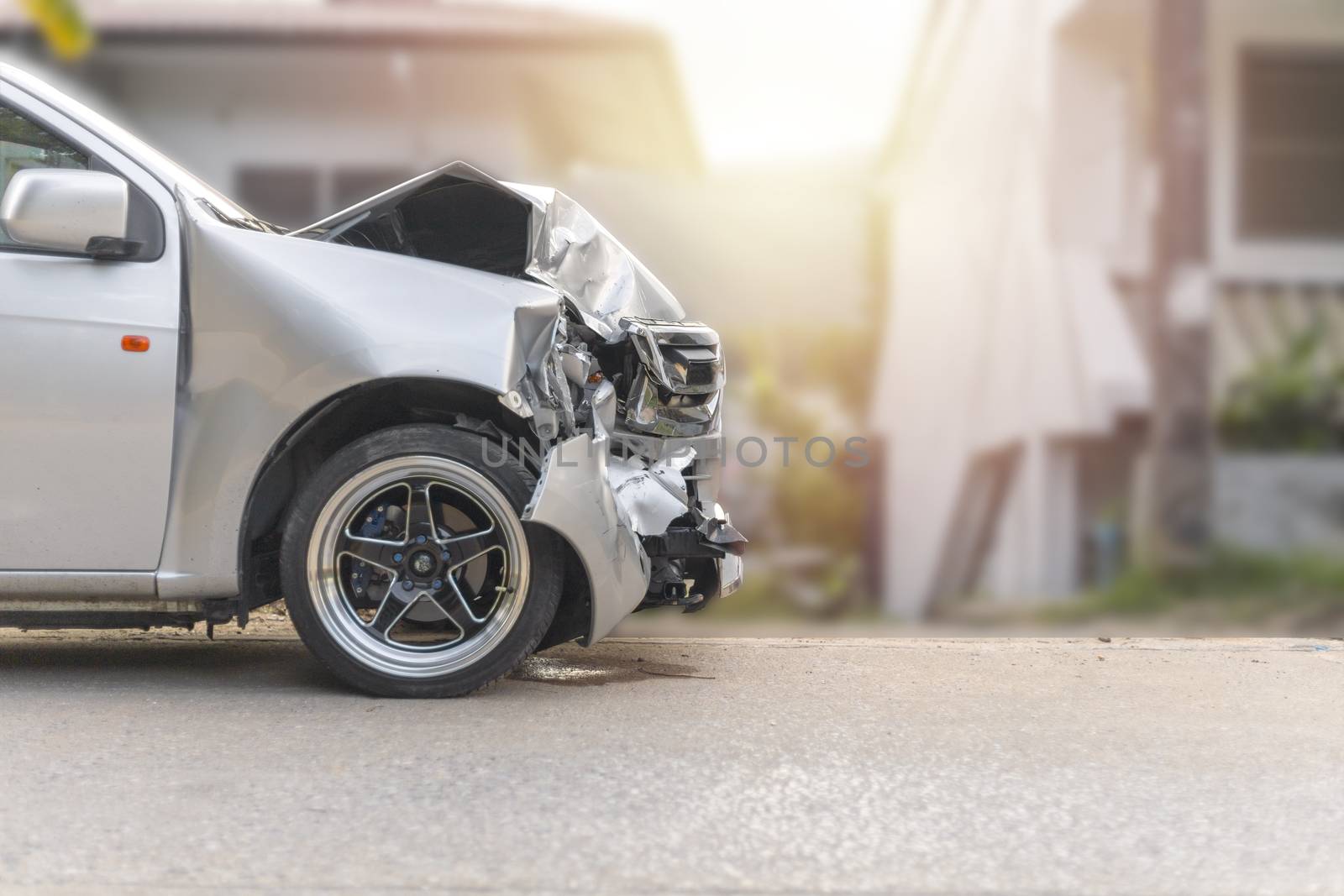 Front of light gray color car damaged and broken by accident on road. With copy space for text or design. Save with cliping path.