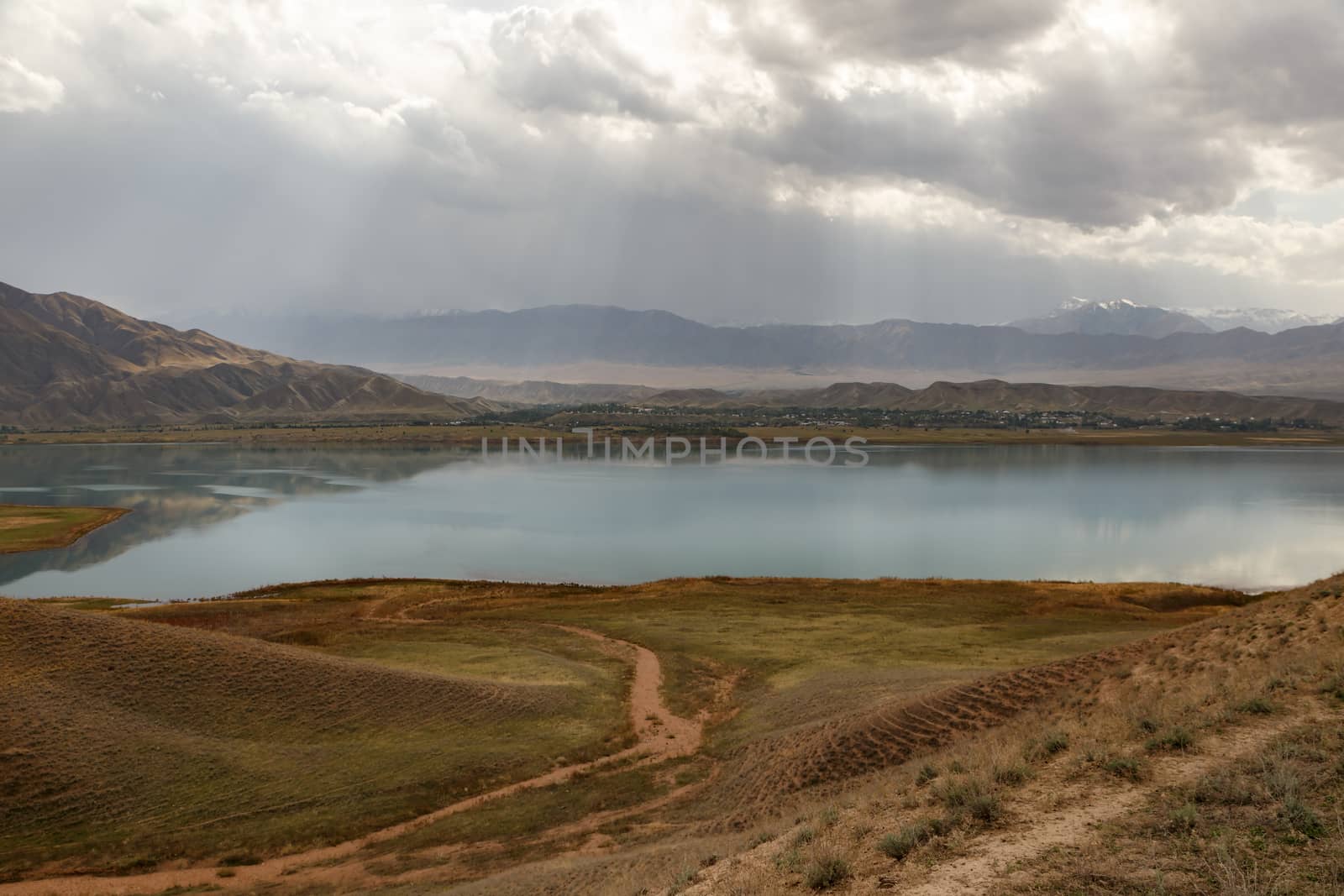 clouds over the Toktogul Reservoir, reservoir in the territory of the Toktogul district of the Jalal-Abad region of Kyrgyzstan.