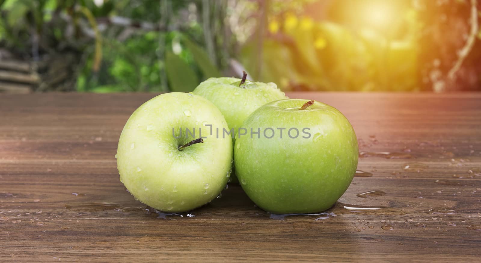 Green apple on table
