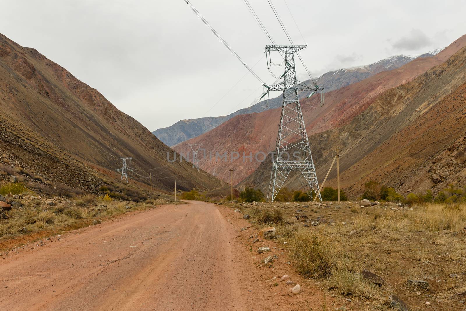 high voltage power transmission pylon in the mountains, high voltage post Mountain landscape, Kyrgyzstan
