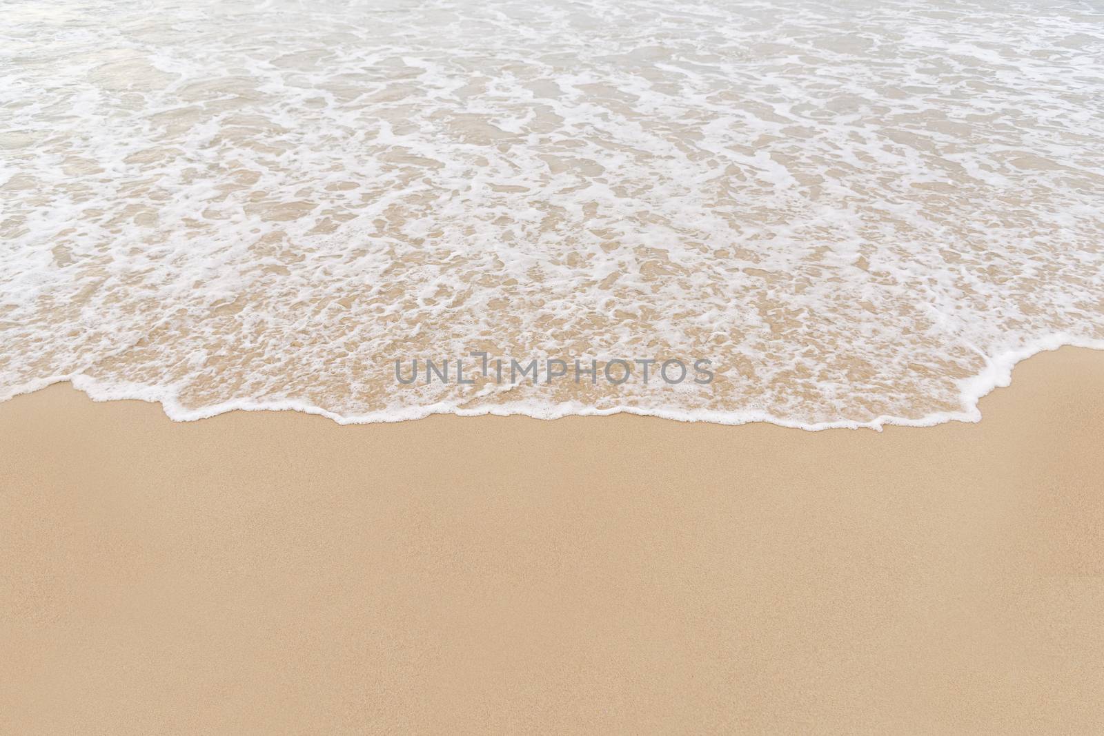 Soft wave on to the beach