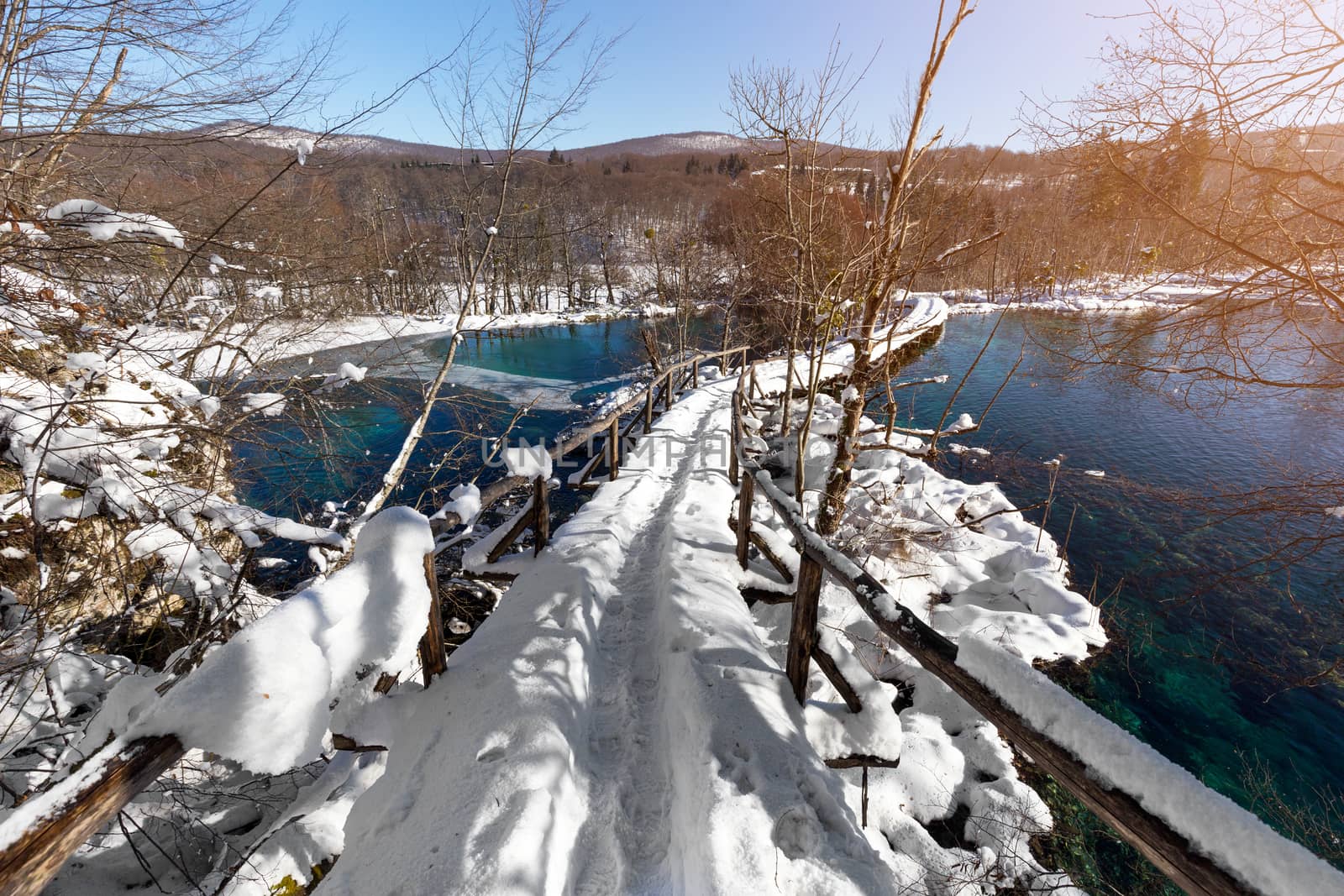 Snow path at Plitvice lakes during winter, Croatia, Europe by necro79