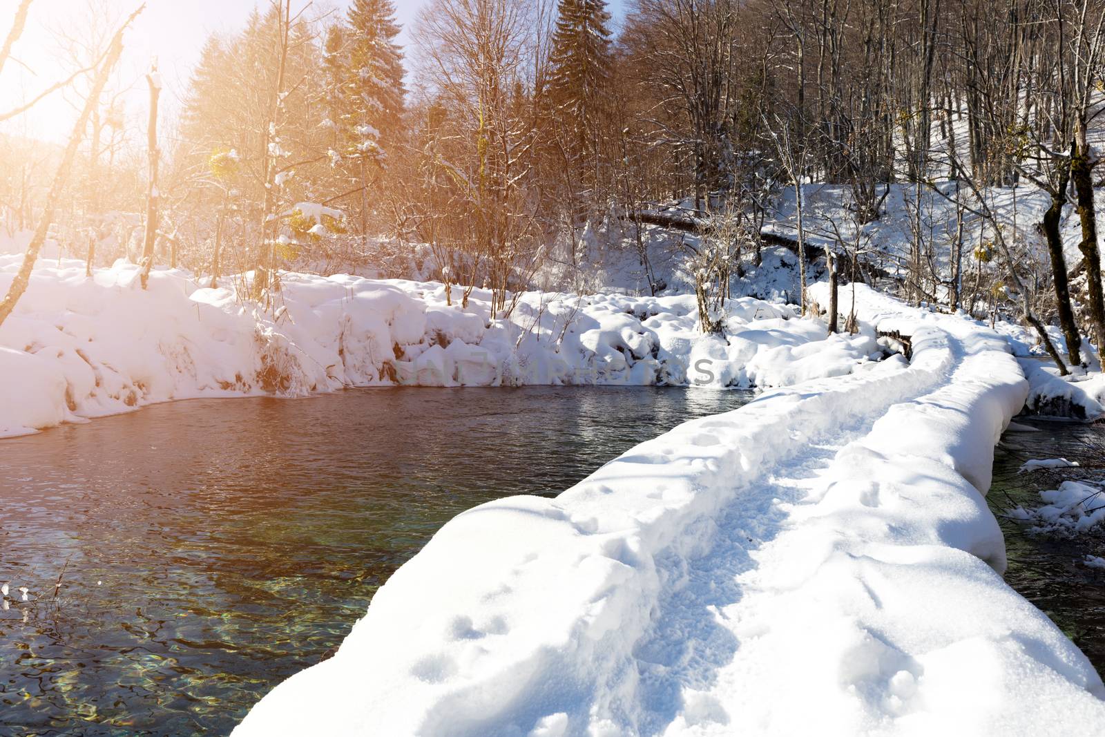 Snow path at Plitvice lakes during winter, Croatia, Europe by necro79