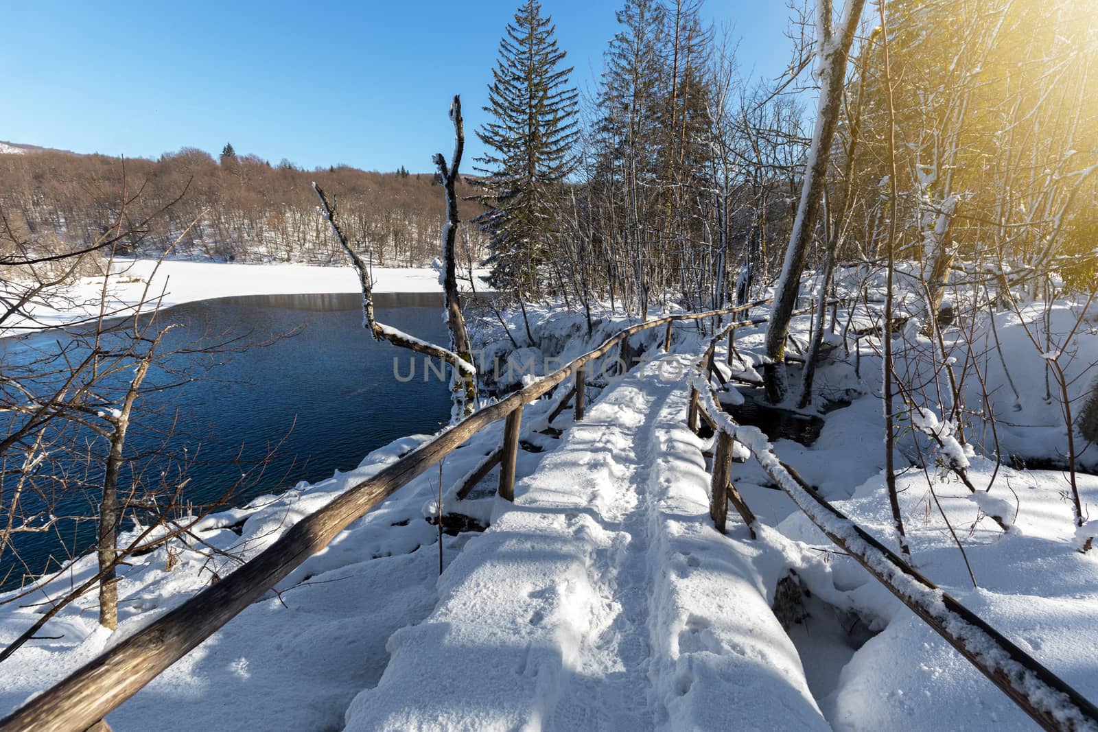 Snow path at Plitvice lakes during winter, Croatia, Europe by necro79