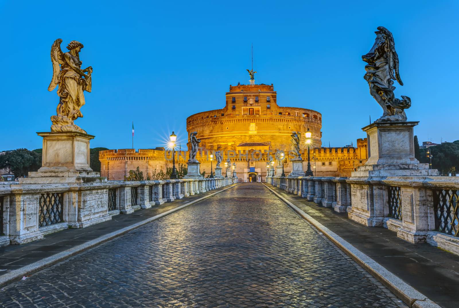 The Castel Sant Angelo and the Sant Angelo bridge in Rome at dawn