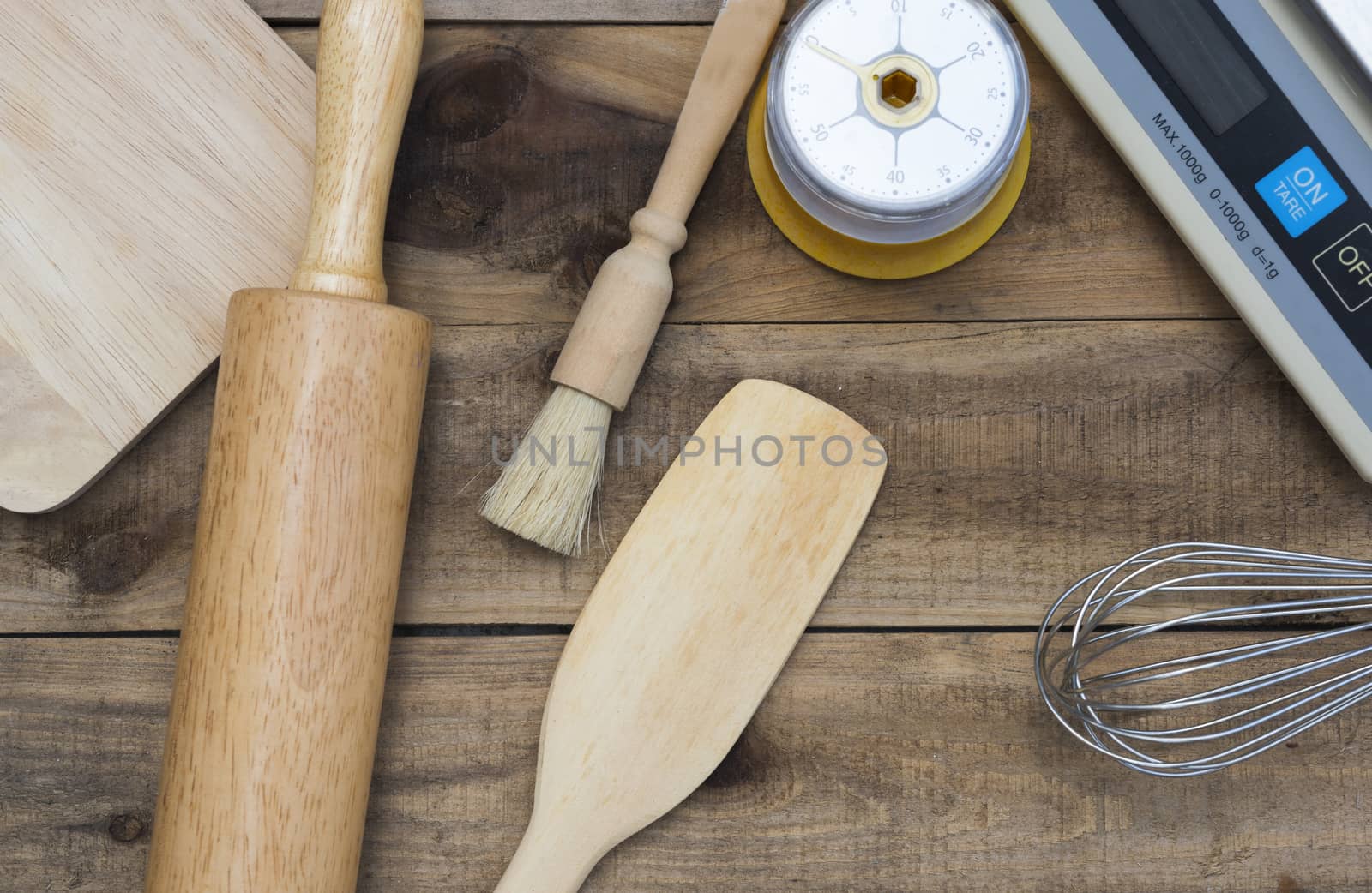 Bakery And Cooking Tools with kitchen timer, scales on wood table