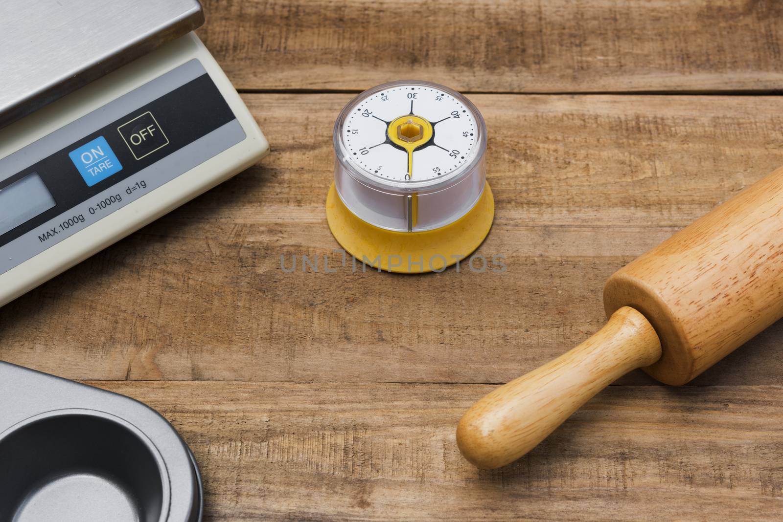 Bakery And Cooking Tools with kitchen timer, scales, kitchen mold on wood table