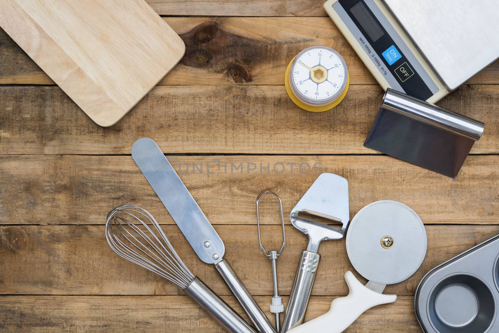 Bakery And Cooking Tools with kitchen timer, scales on wood table
